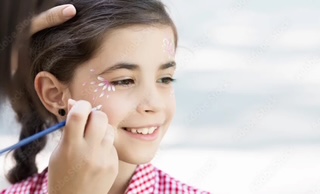 Face painting activities for children in The Sanderling Resort