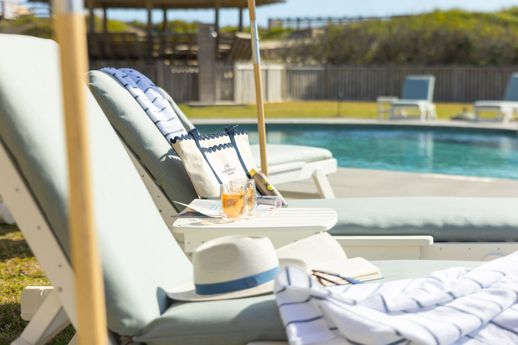 Pool chairs and drinks at The Sanderling