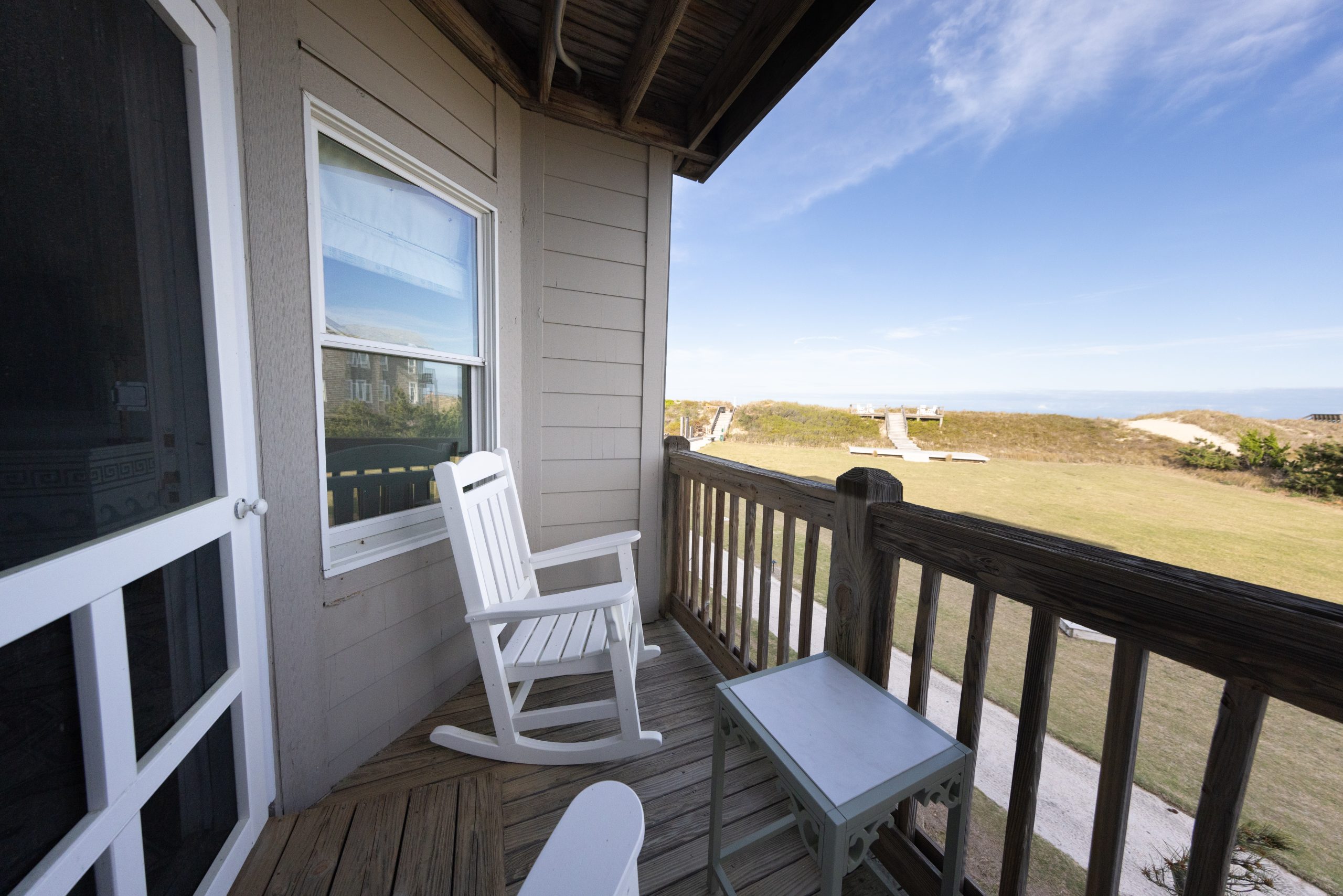 The Sanderling Resort Balcony facing the spacious event lawn.